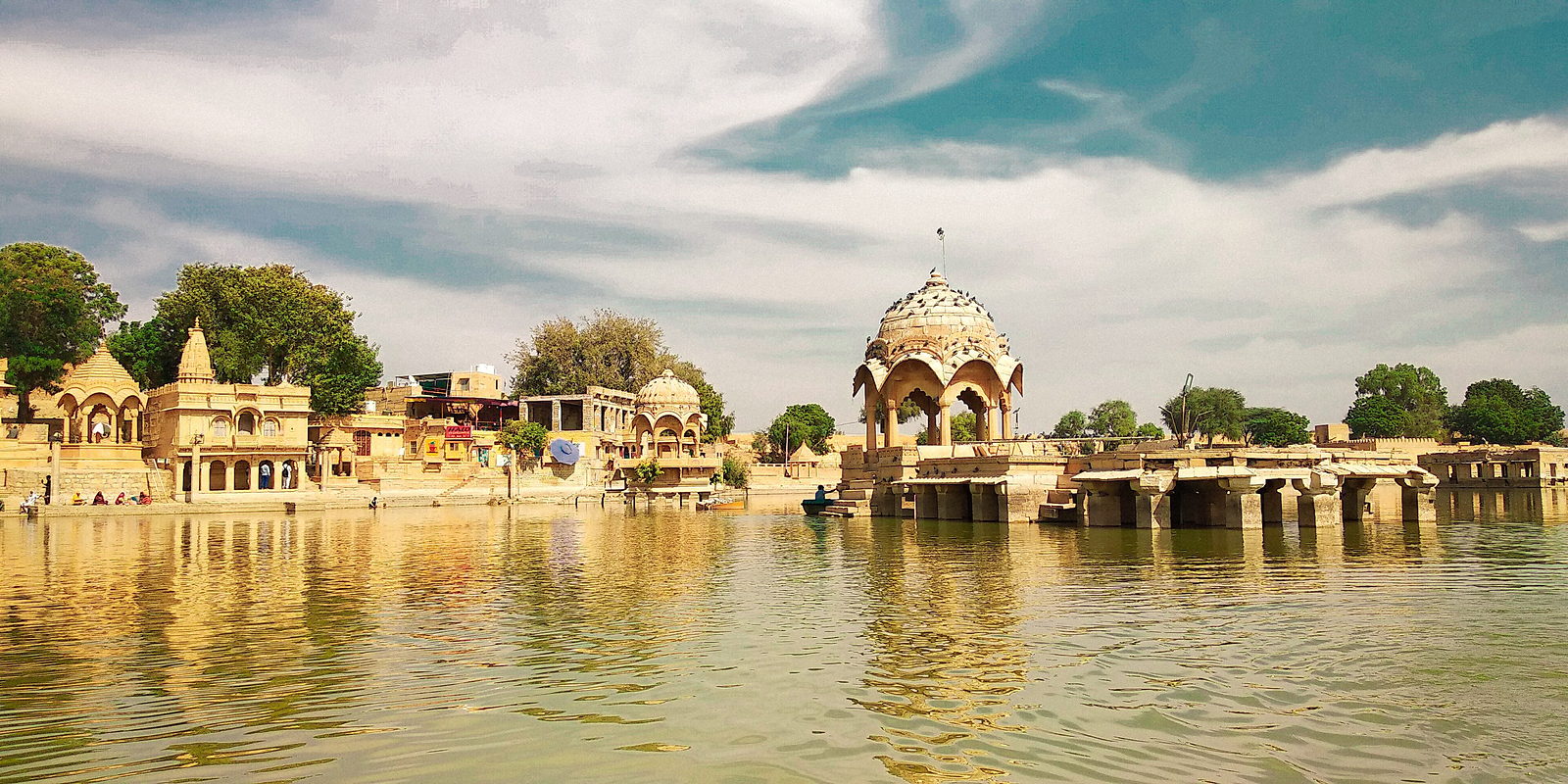 Stone pavilion standing in the water of Gadisar Lake