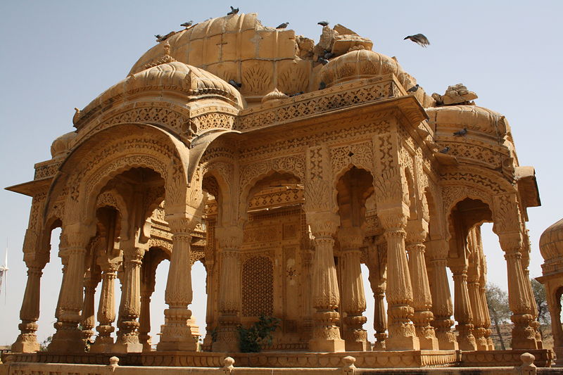 Sandstone chhatris against a blue sky