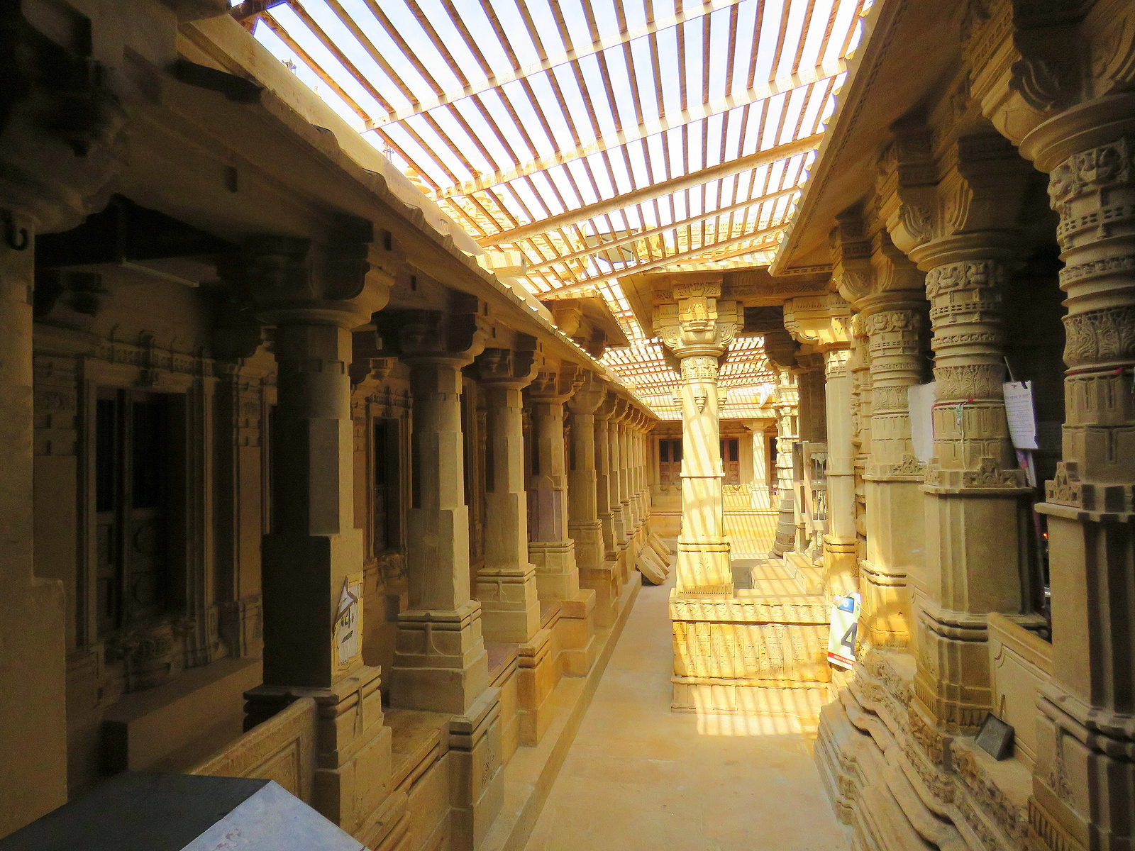 Carved sandstone corridor of a Jain temple inside the fort
