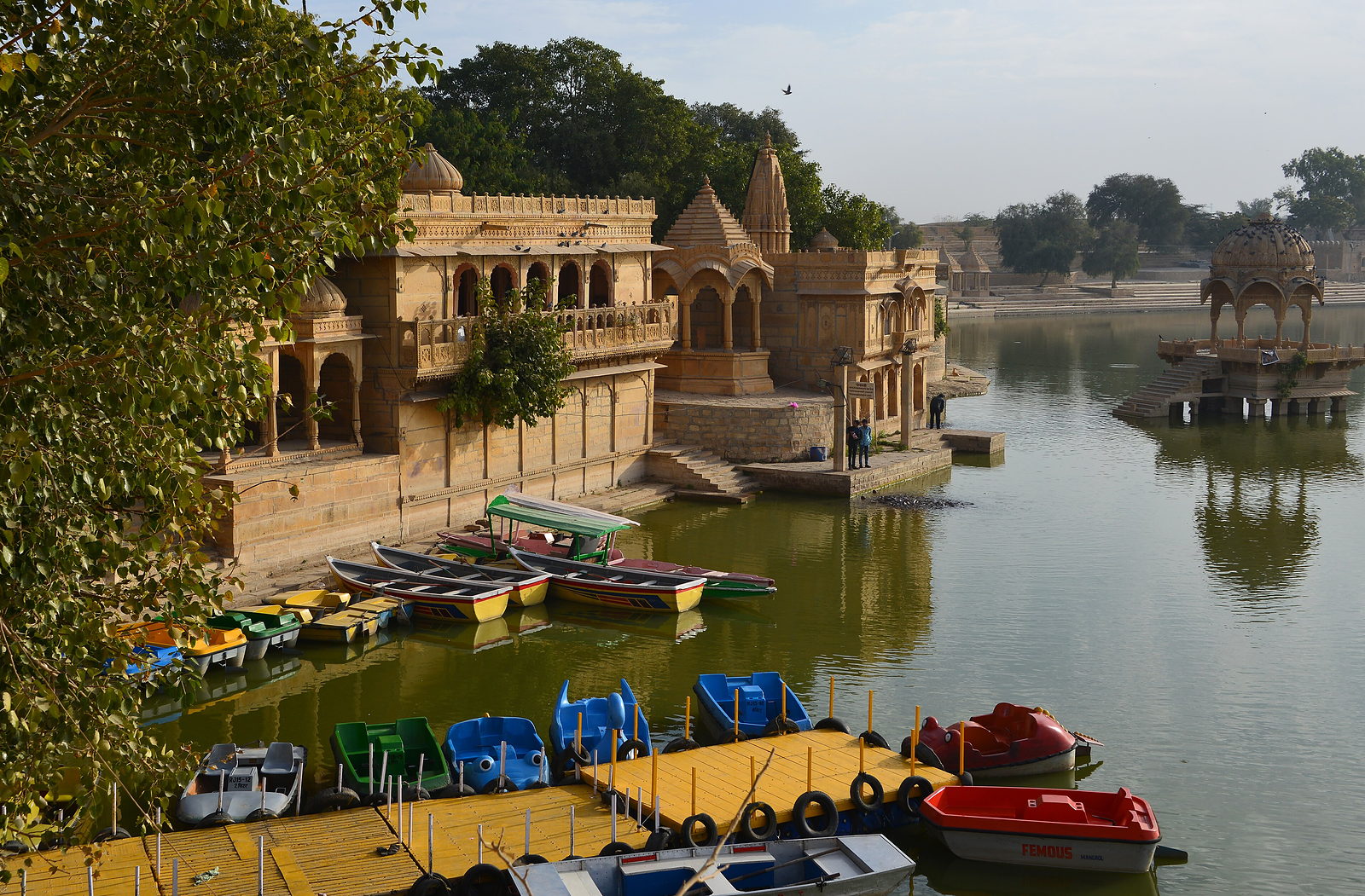 Stone ghats and pavilion beside the lake at dusk