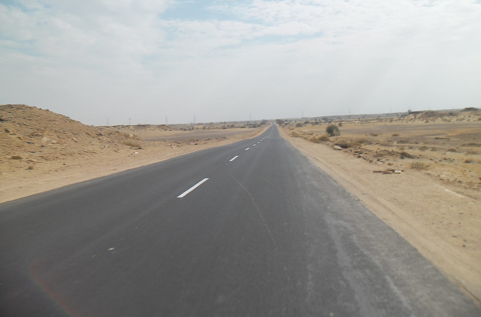 Open desert highway west of Jaisalmer, the Urbania route to Jodhpur and Jaipur